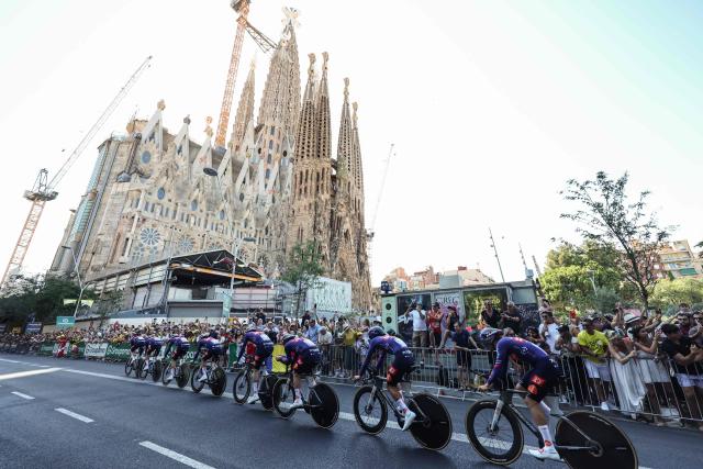 Picnic-PostNL team riders cycle past the Sagrada Familia Basilica during the 1st stage of the 113th edition of the Tour de France cycling race, a 19,6 km team time trial stage in and around Barcelona in northeastern Spain, on July 4, 2026. (Photo by Josep LAGO / AFP)