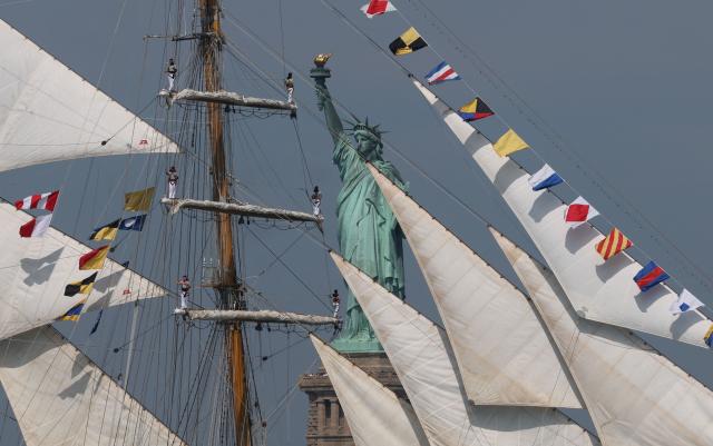 Argentine tall ship Libertad sails past the Statue of Liberty during Sail 4th 250 in New York, on July 4, 2026. Millions of Americans celebrated the country's 250th birthday on Saturday -- a landmark celebration that comes at a time of deep political division, with a president determined to put his stamp on the festivities. Washington's traditional fireworks display on the National Mall -- lined with monuments celebrating the nation's Founding Fathers -- has been super-sized, and is being touted as the biggest ever. (Photo by TIMOTHY A. CLARY / AFP)