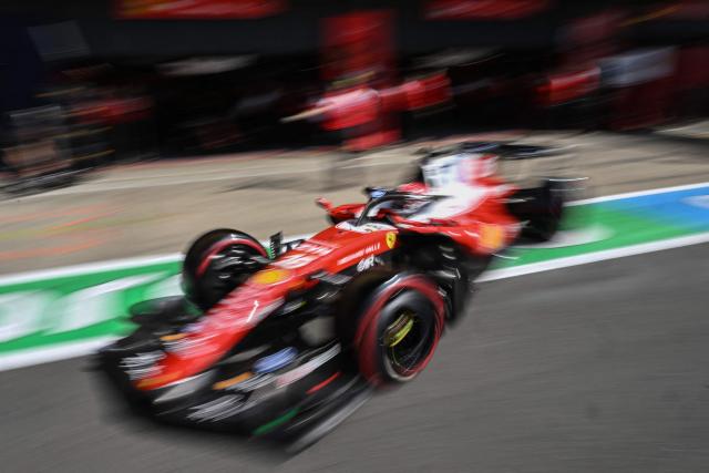 Ferrari's Monegasque driver Charles Leclerc drives out of the garage to take part in the qualifying session ahead of the Formula One British Grand Prix at the Silverstone motor racing circuit in Silverstone, central England, on July 4, 2026. (Photo by PETER POWELL / AFP)
