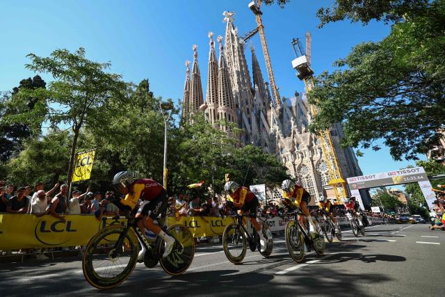 Cofidis team riders cycle past the Sagrada Familia Basilica during the 1st stage of the 113th edition of the Tour de France cycling race, a 19,6 km team time trial stage in and around Barcelona in northeastern Spain, on July 4, 2026. (Photo by Anne-Christine POUJOULAT / AFP)