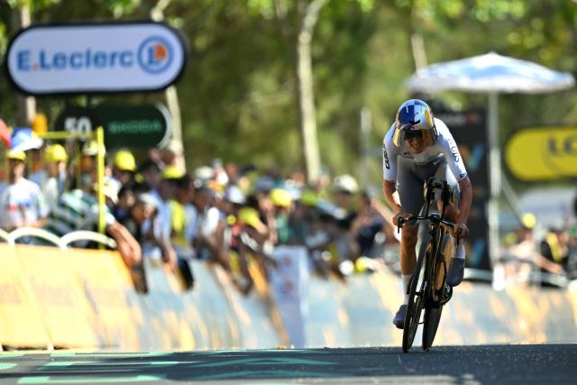 Pinarello Q36.5 Pro Cycling Team's British rider Tom Pidcock cycles to the finish line of the 1st stage of the 113th edition of the Tour de France cycling race, a 19,6 km team time trial stage in and around Barcelona in northeastern Spain, on July 4, 2026. (Photo by Loic VENANCE / AFP)