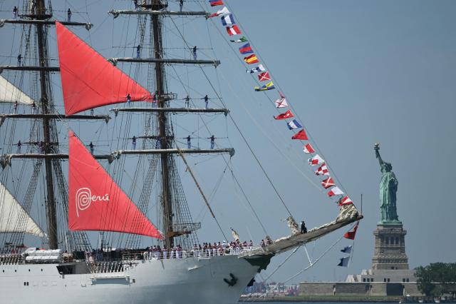 Peruvian training ship BAP Union sails past the Statue of Liberty during the Sail 4th 250 Parade of Ships in New York harbor in New York, on July 4, 2026. Millions of Americans celebrated the country's 250th birthday on Saturday -- a landmark celebration that comes at a time of deep political division, with a president determined to put his stamp on the festivities. Washington's traditional fireworks display on the National Mall -- lined with monuments celebrating the nation's Founding Fathers -- has been super-sized, and is being touted as the biggest ever. (Photo by ANGELA WEISS / AFP)