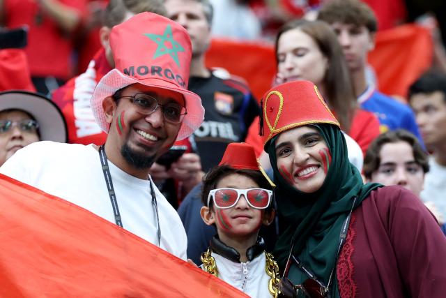 Moroccan fans pose for a photo ahead of the 2026 World Cup round of 16 football match between Canada and Morocco at the Houston Stadium in Houston on July 4, 2026.  (Photo by Thomas COEX / AFP)