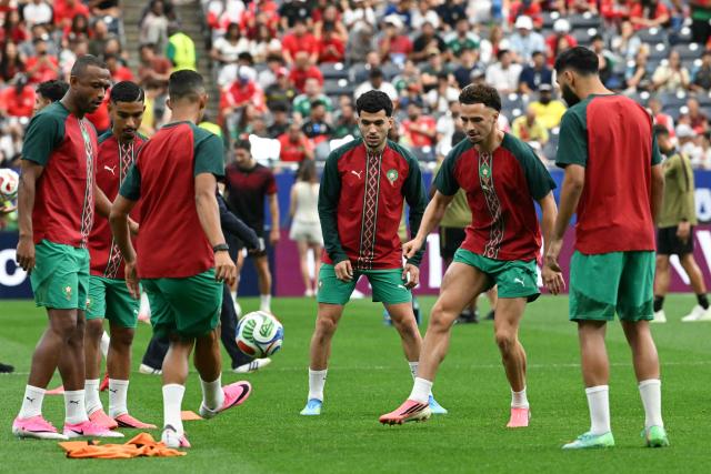 Morocco's players warm up ahead of the 2026 World Cup round of 16 football match between Canada and Morocco at the Houston Stadium in Houston on July 4, 2026.  (Photo by RONALDO SCHEMIDT / AFP)