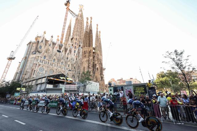 Soudal Quick-Step team riders cycle past the Sagrada Familia Basilica during the 1st stage of the 113th edition of the Tour de France cycling race, a 19,6 km team time trial stage in and around Barcelona in northeastern Spain, on July 4, 2026. (Photo by Josep LAGO / AFP)
