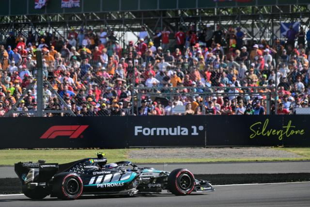 Mercedes' Italian driver Kimi Antonelli celebrates after taking pole position in the qualifying session ahead of the Formula One British Grand Prix at the Silverstone motor racing circuit in Silverstone, central England, on July 4, 2026. (Photo by Andrej ISAKOVIC / AFP)