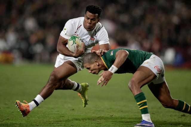 England's wing Immanuel Feyi-Waboso is tackled by South Africa's fly-half Manie Libbok during the rugby Nations Championship match between South Africa and England at Ellis Park Stadium in Johannesburg on July 4, 2026. (Photo by PHILL MAGAKOE / AFP)