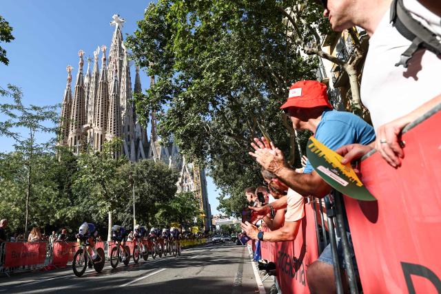 Alpecin - Premier Tech team riders cycle past the Sagrada Familia Basilica during the 1st stage of the 113th edition of the Tour de France cycling race, a 19,6 km team time trial stage in and around Barcelona in northeastern Spain, on July 4, 2026. (Photo by Anne-Christine POUJOULAT / AFP)