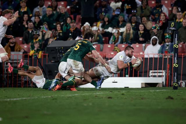 England's lock George Martin dives across the line to score a try during the rugby Nations Championship match between South Africa and England at Ellis Park Stadium in Johannesburg on July 4, 2026. (Photo by PHILL MAGAKOE / AFP)
