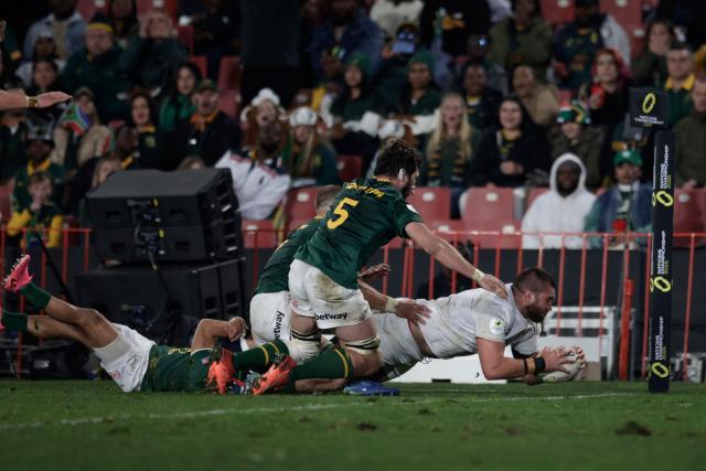 England's lock George Martin dives across the line to score a try during the rugby Nations Championship match between South Africa and England at Ellis Park Stadium in Johannesburg on July 4, 2026. (Photo by PHILL MAGAKOE / AFP)