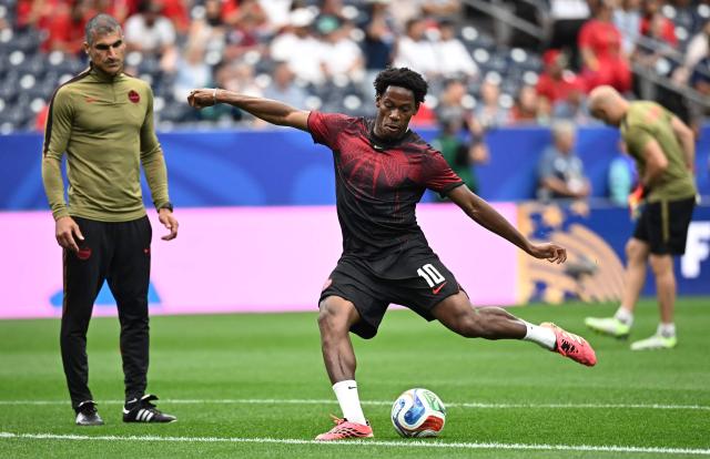 Canada's forward #10 Jonathan David warms up ahead of the 2026 World Cup round of 16 football match between Canada and Morocco at the Houston Stadium in Houston on July 4, 2026.  (Photo by Paul ELLIS / AFP)