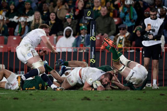 England's lock George Martin (C) celebrates after scoring a try during the rugby Nations Championship match between South Africa and England at Ellis Park Stadium in Johannesburg on July 4, 2026. (Photo by PHILL MAGAKOE / AFP)