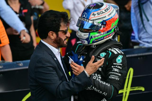 Mercedes' Italian driver Kimi Antonelli (R) is congratulated by FIA president Ben Sulayem after taking pole position in the qualifying session ahead of the Formula One British Grand Prix at the Silverstone motor racing circuit in Silverstone, central England, on July 4, 2026. (Photo by Andrej ISAKOVIC / AFP)