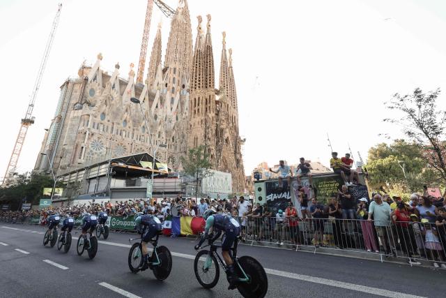 Bahrain - Victorious team riders cycle past the Sagrada Familia Basilica during the 1st stage of the 113th edition of the Tour de France cycling race, a 19,6 km team time trial stage in and around Barcelona in northeastern Spain, on July 4, 2026. (Photo by Josep LAGO / AFP)