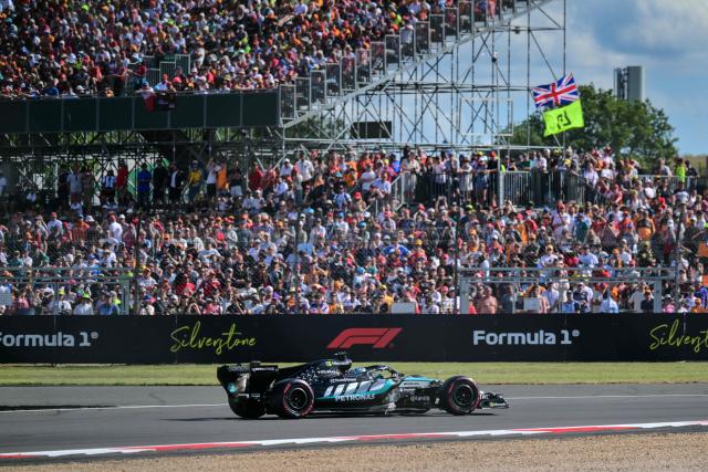 Mercedes' Italian driver Kimi Antonelli celebrates after taking pole position in the qualifying session ahead of the Formula One British Grand Prix at the Silverstone motor racing circuit in Silverstone, central England, on July 4, 2026. (Photo by Andrej ISAKOVIC / AFP)