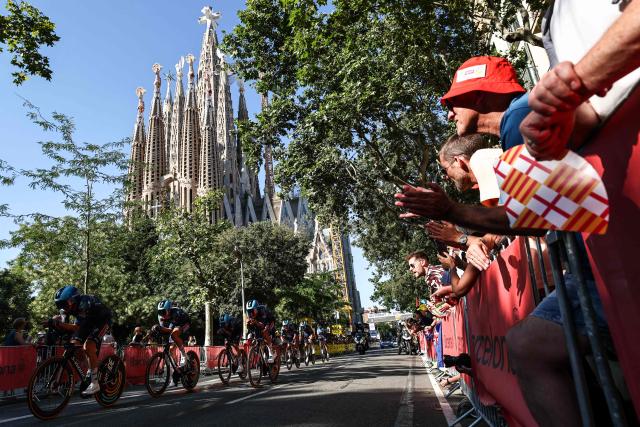 Soudal Quick-Step team riders cycle past the Sagrada Familia Basilica during the 1st stage of the 113th edition of the Tour de France cycling race, a 19,6 km team time trial stage in and around Barcelona in northeastern Spain, on July 4, 2026. (Photo by Anne-Christine POUJOULAT / AFP)