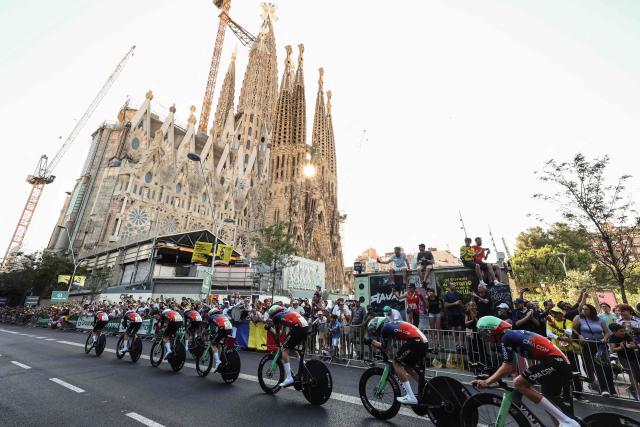 Decathlon CMA CGM Team riders cycle past the Sagrada Familia Basilica during the 1st stage of the 113th edition of the Tour de France cycling race, a 19,6 km team time trial stage in and around Barcelona in northeastern Spain, on July 4, 2026. (Photo by Josep LAGO / AFP)