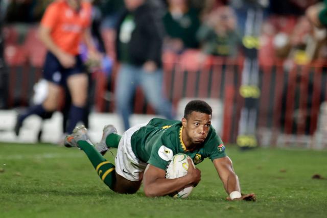 South Africa's scrum-half Grant Williams scores a try during the rugby Nations Championship match between South Africa and England at Ellis Park Stadium in Johannesburg on July 4, 2026. (Photo by PHILL MAGAKOE / AFP)