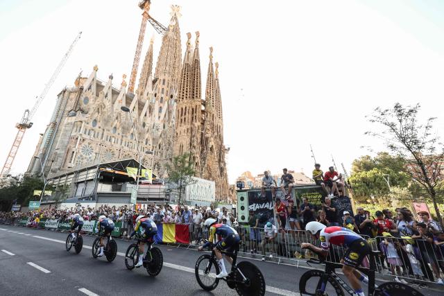 Lidl - Trek team riders cycle past the Sagrada Familia Basilica during the 1st stage of the 113th edition of the Tour de France cycling race, a 19,6 km team time trial stage in and around Barcelona in northeastern Spain, on July 4, 2026. (Photo by Josep LAGO / AFP)