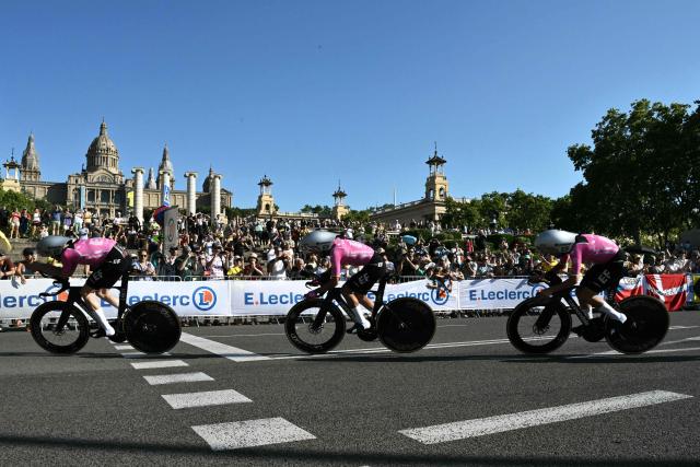 The team EF Education-Easy post cycles next to the Palau nacional ('National Palace')  on the hill of Montjuic during the 1st stage of the 113th edition of the Tour de France cycling race, a 19,6 km team time trial stage in and around Barcelona in northeastern Spain, on July 4, 2026. (Photo by Jeff PACHOUD / AFP)