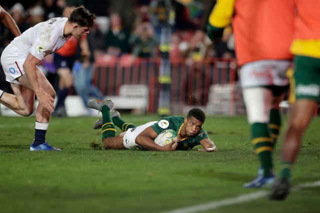 TOPSHOT - South Africa's scrum-half Grant Williams scores a try during the rugby Nations Championship match between South Africa and England at Ellis Park Stadium in Johannesburg on July 4, 2026. (Photo by PHILL MAGAKOE / AFP)