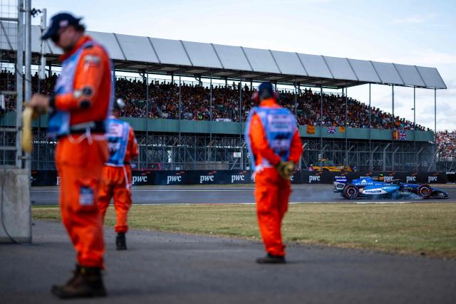 Williams' Spanish driver Carlos Sainz locks up into a turn during the qualifying session ahead of the Formula One British Grand Prix at the Silverstone motor racing circuit in Silverstone, central England, on July 4, 2026. (Photo by Ben STANSALL / AFP)