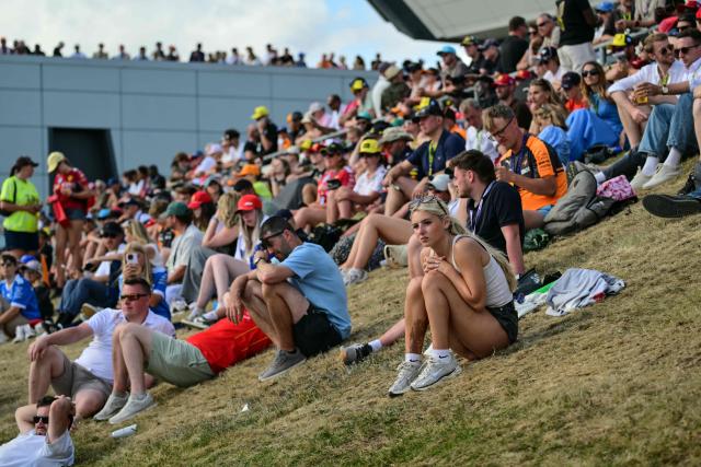 Spectators watch the action during the qualifying session ahead of the Formula One British Grand Prix at the Silverstone motor racing circuit in Silverstone, central England, on July 4, 2026. (Photo by Andrej ISAKOVIC / AFP)