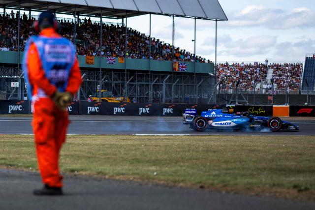 Williams' Spanish driver Carlos Sainz locks up into a turn during the qualifying session ahead of the Formula One British Grand Prix at the Silverstone motor racing circuit in Silverstone, central England, on July 4, 2026. (Photo by Ben STANSALL / AFP)