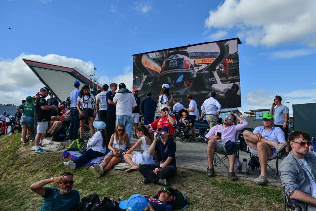 Spectators attend the qualifying session ahead of the Formula One British Grand Prix at the Silverstone motor racing circuit in Silverstone, central England, on July 4, 2026. (Photo by Andrej ISAKOVIC / AFP)