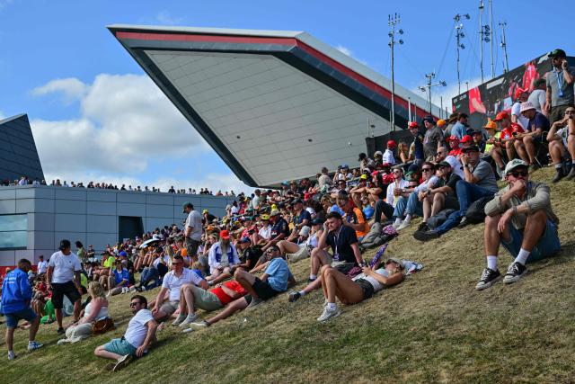 Spectators attend the qualifying session ahead of the Formula One British Grand Prix at the Silverstone motor racing circuit in Silverstone, central England, on July 4, 2026. (Photo by Andrej ISAKOVIC / AFP)