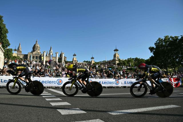 Team Visma | Lease a Bike's Danish rider Jonas Vingegaard (R) cycles with his team next to the Palau nacional ('National Palace')  on the hill of Montjuic during the 1st stage of the 113th edition of the Tour de France cycling race, a 19,6 km team time trial stage in and around Barcelona in northeastern Spain, on July 4, 2026. (Photo by Jeff PACHOUD / AFP)