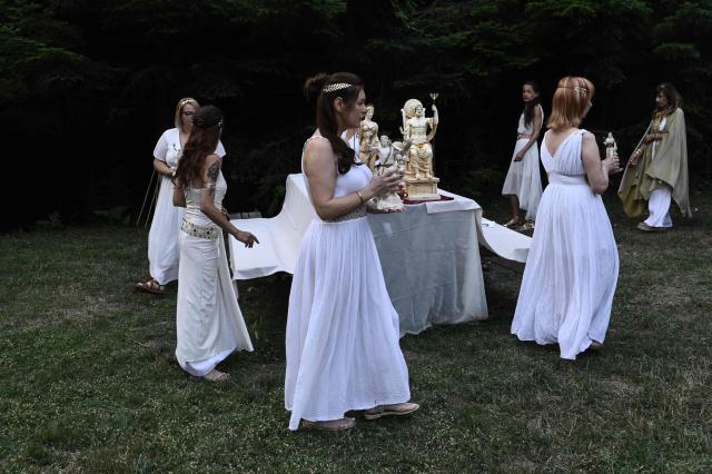 Reenactors dressed as ancient Greeks perform a ritual at the foothills of Mount Olympus as part of the four-day Promitheia Festival honouring ancient Greek Gods, near Litochoro, northern Greece, on July 3, 2026. (Photo by Sakis Mitrolidis / AFP)