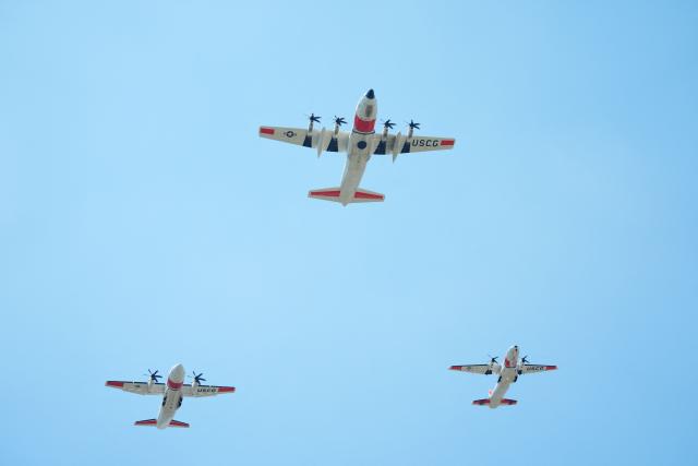 US Coast Guard fixed-wing turboprop planes fly over as part of the "Salute to America" Independence Day celebration on the National Mall in Washington, DC, on July 4, 2026. The nation is marking the 250th anniversary of the United States Declaration of Indpendence. (Photo by Ken Cedeno / AFP)