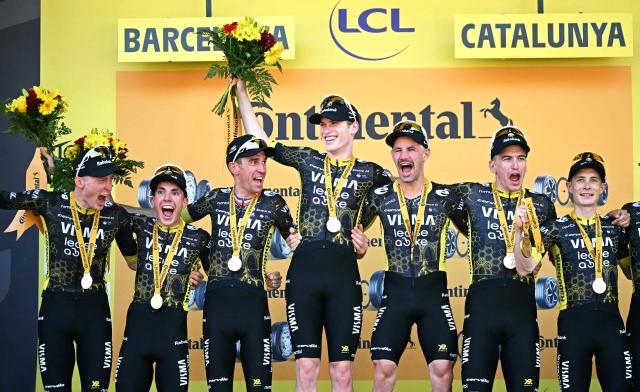 Team Visma | Lease a Bike's team celebrates on the podium after winning the 1st stage of the 113th edition of the Tour de France cycling race, a 19 km team time trial stage in and around Barcelona in northeastern Spain, on July 4, 2026. (Photo by Loic VENANCE / AFP)