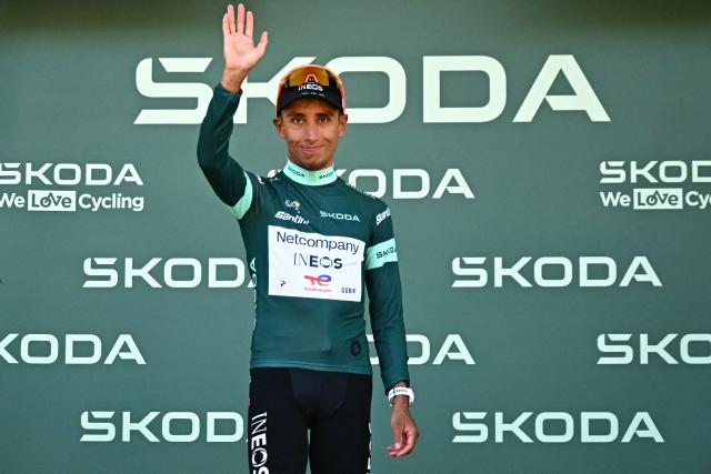 Netcompany INEOS team's Colombian rider Egan Bernal celebrates on the podium with the best sprinter's green jersey after the 1st stage of the 113th edition of the Tour de France cycling race, a 19 km team time trial stage in and around Barcelona in northeastern Spain, on July 4, 2026. (Photo by Loic VENANCE / AFP)