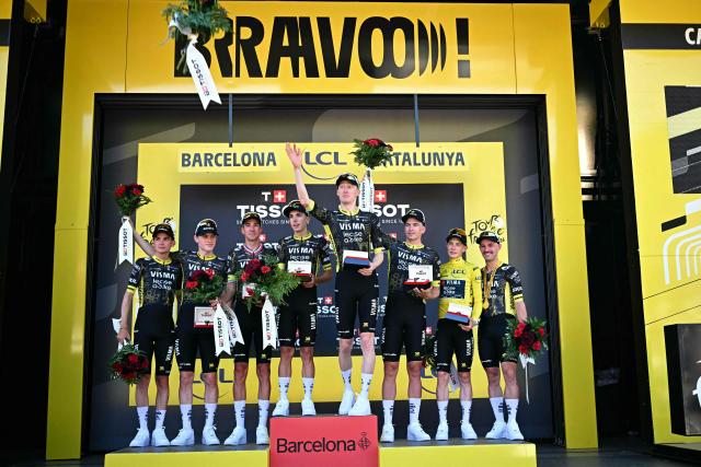 Team Visma - Lease a bike team riders celebrates on the podium after winning the 1st stage of the 113th edition of the Tour de France cycling race, a 19 km team time trial stage in and around Barcelona in northeastern Spain, on July 4, 2026. (Photo by Loic VENANCE / AFP)