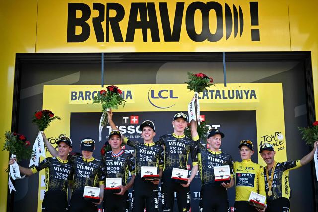 Team Visma - Lease a bike team riders celebrates on the podium after winning the 1st stage of the 113th edition of the Tour de France cycling race, a 19 km team time trial stage in and around Barcelona in northeastern Spain, on July 4, 2026. (Photo by Loic VENANCE / AFP)