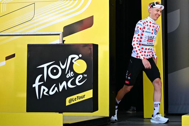 UAE Team Emirates - XRG's Slovenian rider Tadej Pogacar celebrates on the podium with the best climber's polka dot (dotted) jersey after the 1st stage of the 113th edition of the Tour de France cycling race, a 19,6 km team time trial stage in and around Barcelona in northeastern Spain, on July 4, 2026. (Photo by Loic VENANCE / AFP)