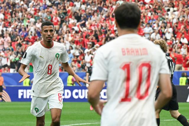 Morocco's midfielder #08 Azzedine Ounahi celebrates scoring his team's second goal with teammate forward #10 Brahim Diaz during the 2026 World Cup round of 16 football match between Canada and Morocco at the Houston Stadium in Houston on July 4, 2026.  (Photo by RONALDO SCHEMIDT / AFP)