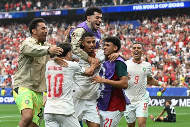 Morocco's midfielder #08 Azzedine Ounahi celebrates scoring his team's second goal with teammates during the 2026 World Cup round of 16 football match between Canada and Morocco at the Houston Stadium in Houston on July 4, 2026.  (Photo by RONALDO SCHEMIDT / AFP)