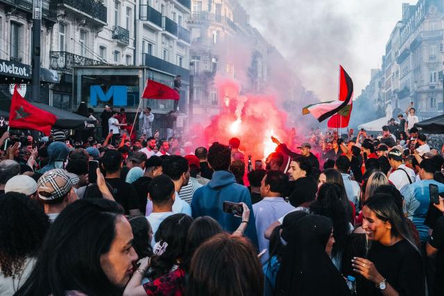 Supporters of Morocco celebrate their team's victory at the end of the 2026 World Cup round of 16 football match between Canada and Morocco, in Brussels on July 4, 2026. (Photo by Marius BURGELMANS / Belga / AFP) / Belgium OUT