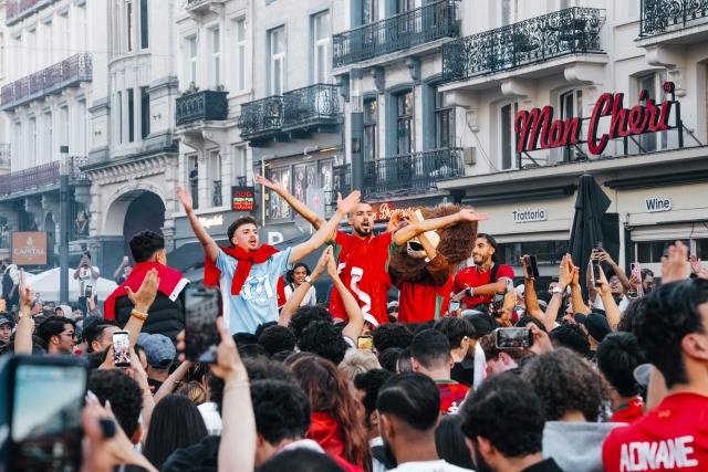 Supporters of Morocco celebrate their team's victory at the end of the 2026 World Cup round of 16 football match between Canada and Morocco, in Brussels on July 4, 2026. (Photo by Marius BURGELMANS / Belga / AFP) / Belgium OUT