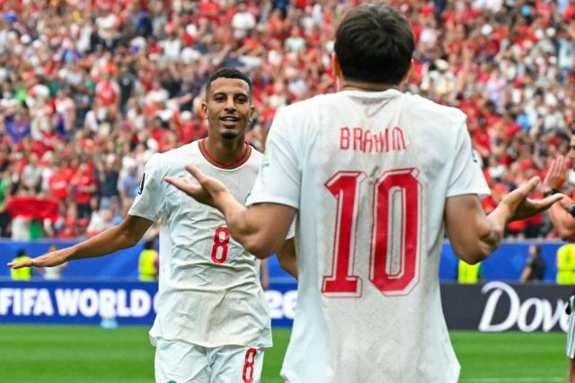 Morocco's midfielder #08 Azzedine Ounahi celebrates scoring his team's second goal with teammate forward #10 Brahim Diaz during the 2026 World Cup round of 16 football match between Canada and Morocco at the Houston Stadium in Houston on July 4, 2026.  (Photo by RONALDO SCHEMIDT / AFP)