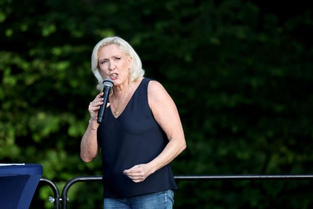 President of Rassemblement National parliamentary group Marine Le Pen addresses the audience during a RN party event "La fete champetre" in Lievin, northern France on July 4, 2026. (Photo by SIMON WOHLFAHRT / AFP)