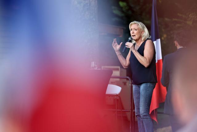 President of Rassemblement National parliamentary group Marine Le Pen addresses the audience during a RN party event "La fete champetre" in Lievin, northern France on July 4, 2026. (Photo by SIMON WOHLFAHRT / AFP)
