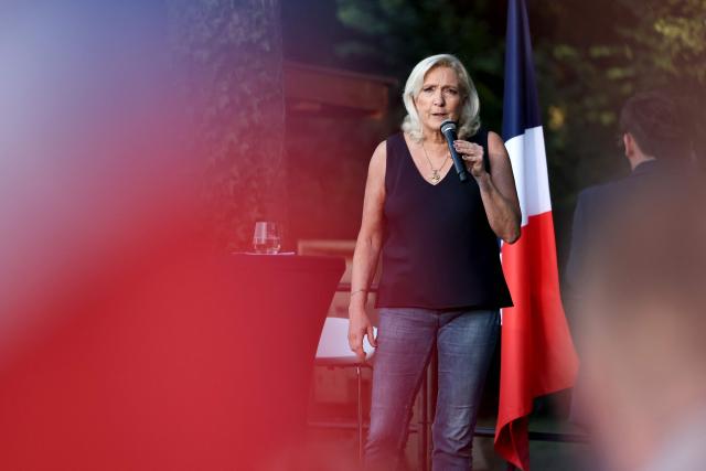 President of Rassemblement National parliamentary group Marine Le Pen addresses the audience during a RN party event "La fete champetre" in Lievin, northern France on July 4, 2026. (Photo by SIMON WOHLFAHRT / AFP)