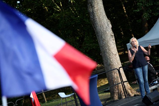 President of Rassemblement National parliamentary group Marine Le Pen addresses the audience during a RN party event "La fete champetre" in Lievin, northern France on July 4, 2026. (Photo by SIMON WOHLFAHRT / AFP)