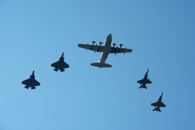 A KC-130 tanker and transport aircraft (C) and US military fighter jets fly overhead during the "Salute to America" Independence Day celebration on the National Mall in Washington, DC, on July 4, 2026. The nation is marking the 250th anniversary of the United States Declaration of Indpendence. (Photo by Ken Cedeno / AFP)