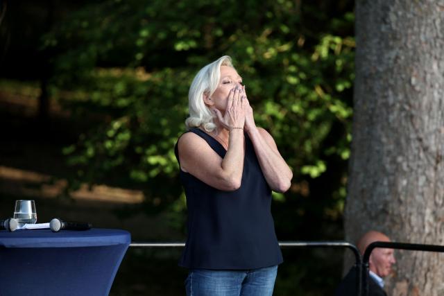 President of Rassemblement National parliamentary group Marine Le Pen reacts as she addresses the audience during a RN party event "La fete champetre" in Lievin, northern France on July 4, 2026. (Photo by SIMON WOHLFAHRT / AFP)