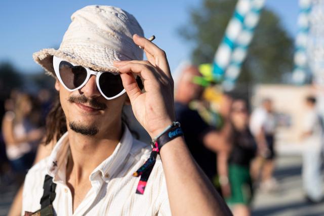 A festivalgoer poses for a photograph during the 36th edition of the Les Eurockeennes de Belfort music festival, in Sermamagny, eastern France, on July 4, 2026. (Photo by ROMEO BOETZLE / AFP)